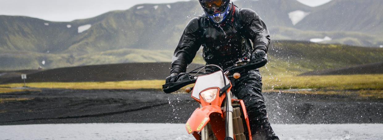 DirectAsia Insurance_motorcyclist on his bike riding on wet grounds