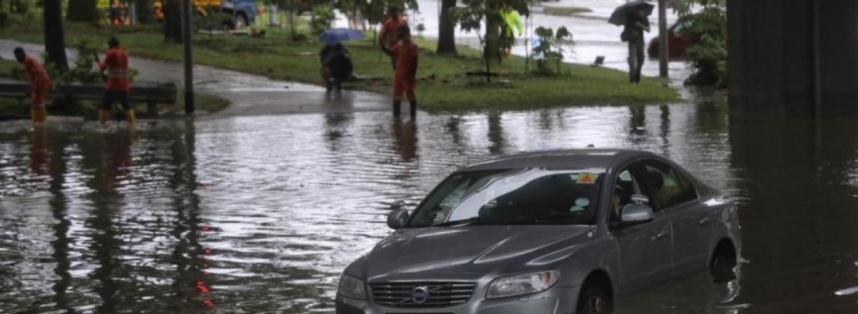 DirectAsia Insurance_A car partially submerged in a flood