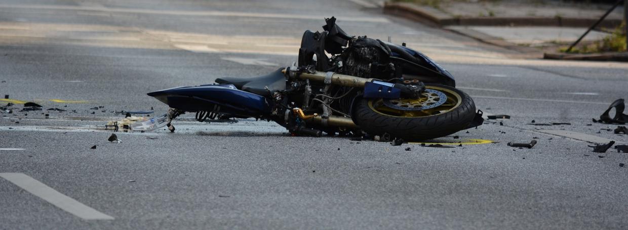 DirectAsia Insurance_Motorcycle lying on the road, crashed